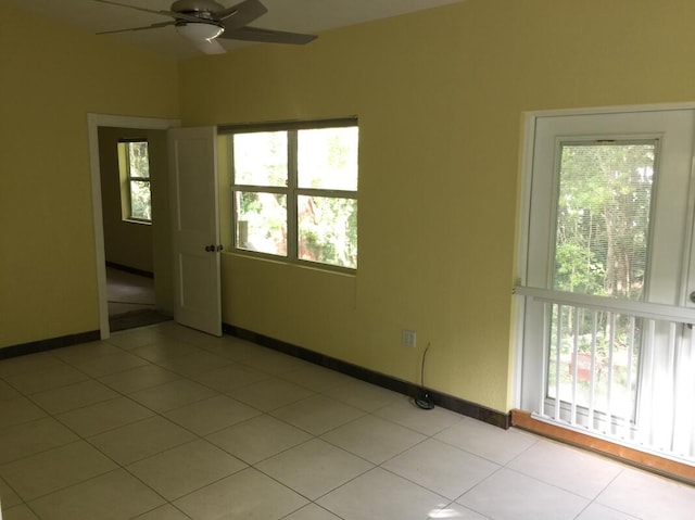 unfurnished room featuring light tile patterned floors and ceiling fan