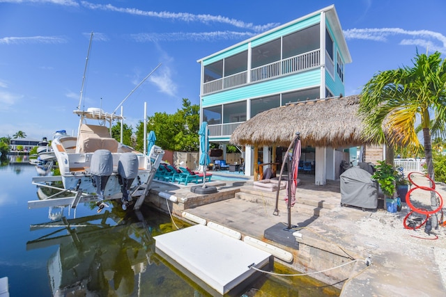 exterior space with a water view and a patio area