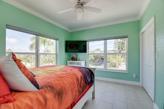 bedroom featuring crown molding and ceiling fan