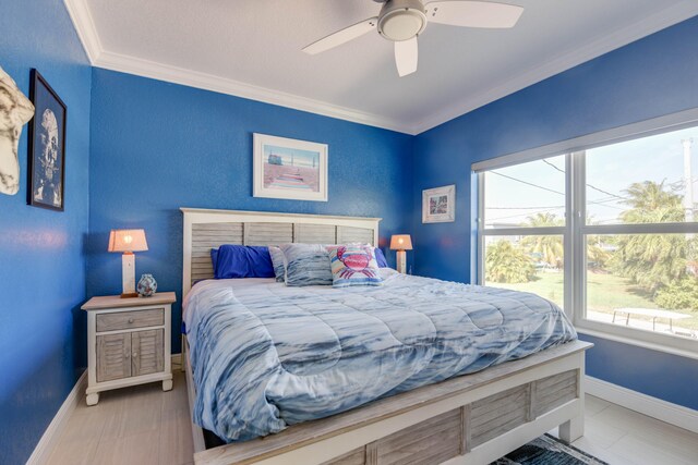 bedroom with crown molding and ceiling fan