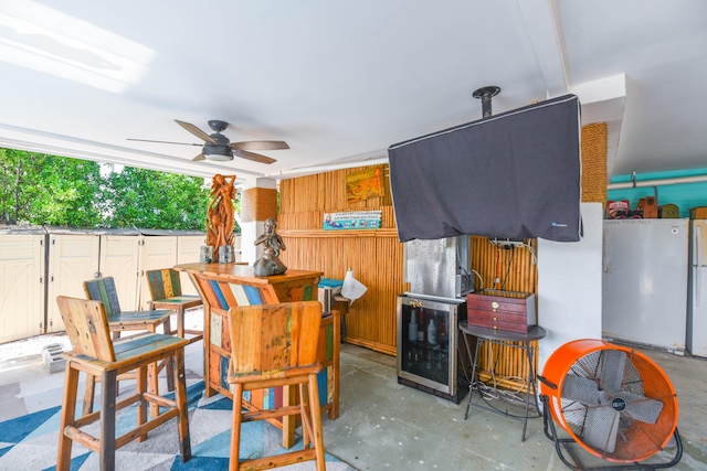 view of patio / terrace featuring an outdoor bar and ceiling fan