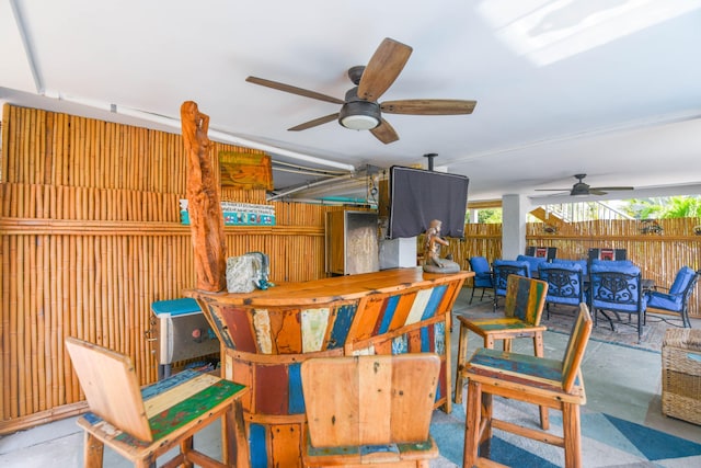 view of patio / terrace featuring an outdoor bar and ceiling fan