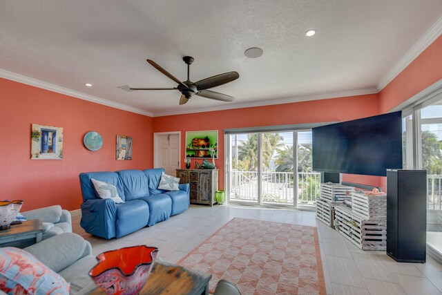 living room with crown molding, ceiling fan, and a textured ceiling