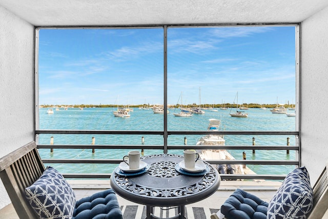 balcony featuring a water view