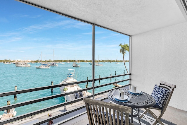 balcony featuring a water view