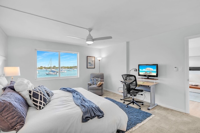 bedroom featuring ceiling fan and light carpet