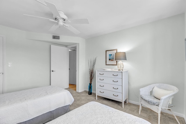 bedroom featuring ceiling fan and light carpet