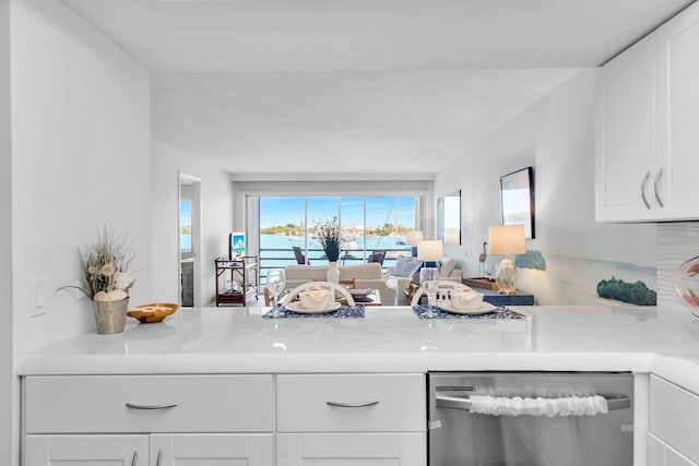 kitchen featuring white cabinetry and dishwasher