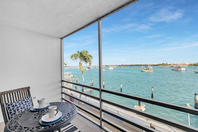 balcony featuring a water view