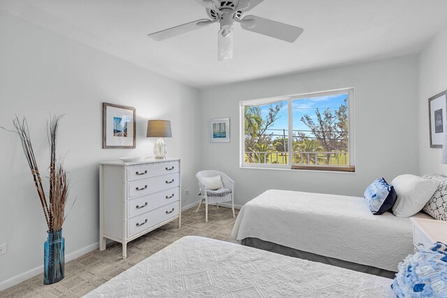 bedroom with ceiling fan and light colored carpet