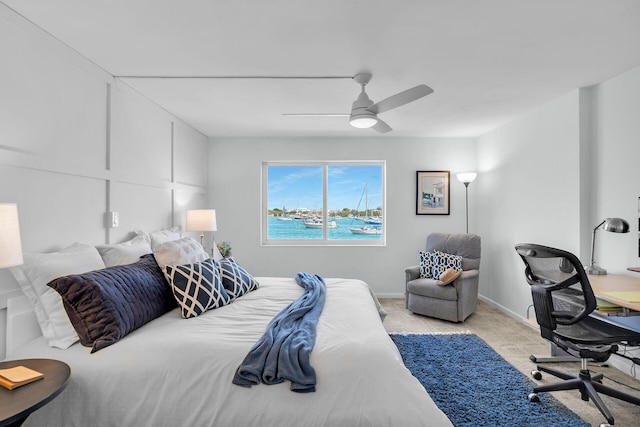 bedroom with light carpet and ceiling fan