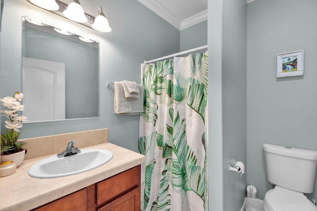 bathroom with vanity, crown molding, toilet, and walk in shower