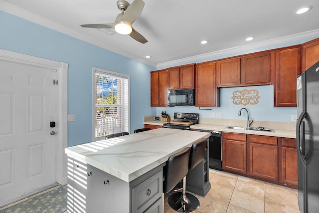 kitchen featuring crown molding, light stone countertops, sink, and black appliances