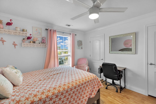 bedroom featuring crown molding, wood-type flooring, and ceiling fan