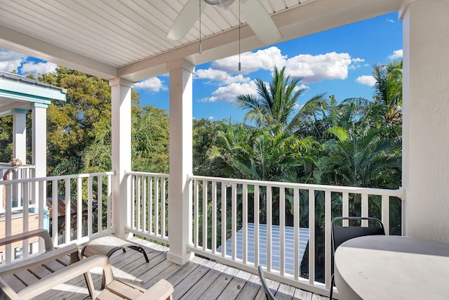 wooden deck with ceiling fan