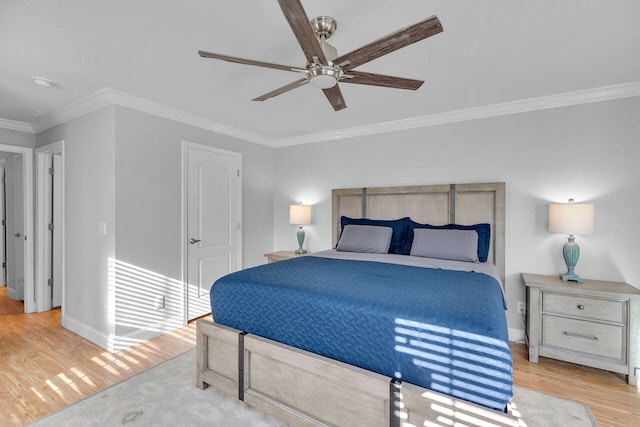 bedroom with crown molding, ceiling fan, and light wood-type flooring