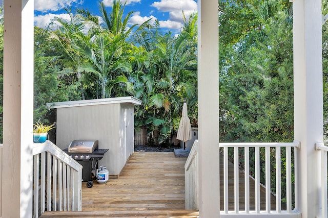 wooden terrace featuring grilling area