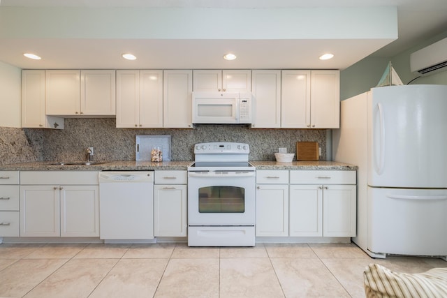 kitchen featuring white cabinetry, sink, white appliances, and tasteful backsplash