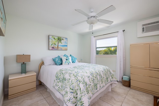 tiled bedroom featuring ceiling fan and a wall unit AC