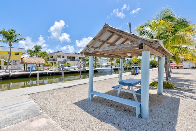 surrounding community featuring a gazebo and a water view