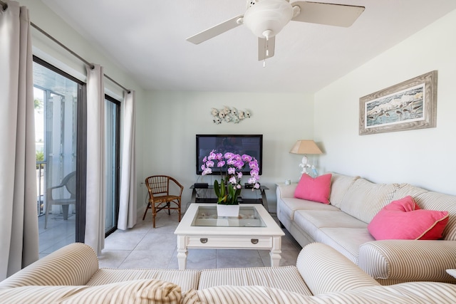 living room featuring light tile patterned floors and ceiling fan