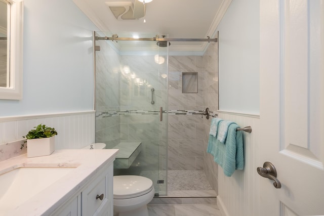 bathroom featuring walk in shower, ornamental molding, vanity, and toilet