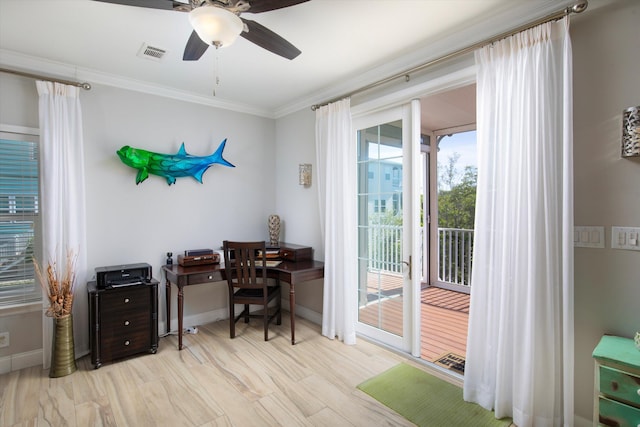 home office with ornamental molding, ceiling fan, and light wood-type flooring