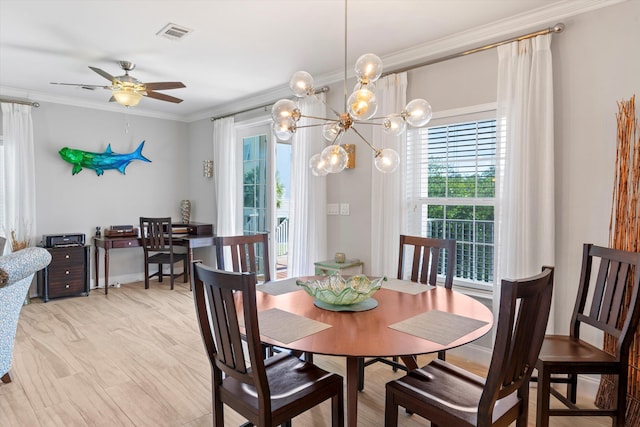 dining space with ceiling fan, ornamental molding, and a healthy amount of sunlight