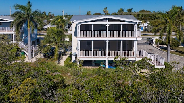 back of property featuring a sunroom