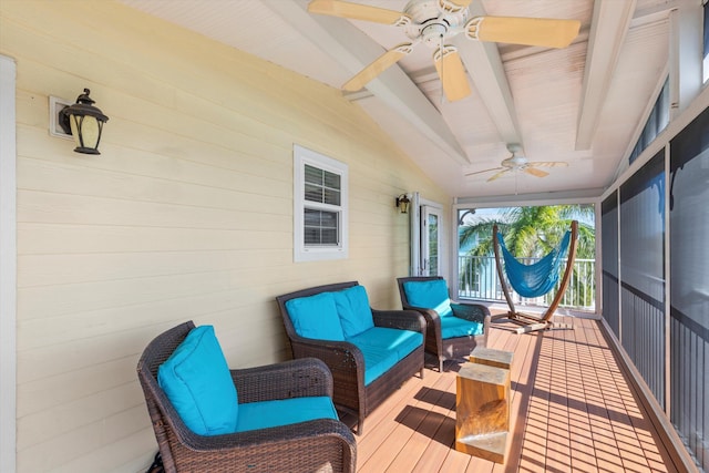 sunroom / solarium with vaulted ceiling with beams and ceiling fan