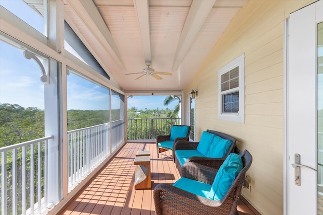 sunroom / solarium with vaulted ceiling with beams and ceiling fan