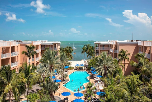 view of swimming pool with a water view