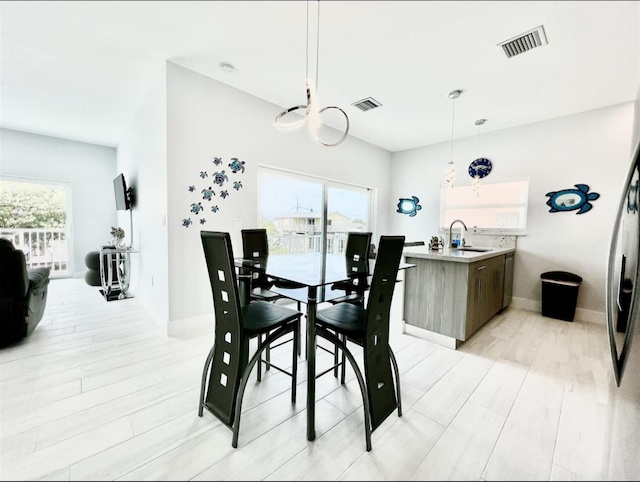 1021 82nd St, Marathon, FL 33050 - dining area featuring visible vents, plenty of natural light, and light wood finished floors