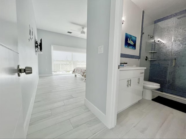 1021 82nd St, Marathon, FL 33050 - bathroom featuring vanity, a ceiling fan, visible vents, a stall shower, and toilet
