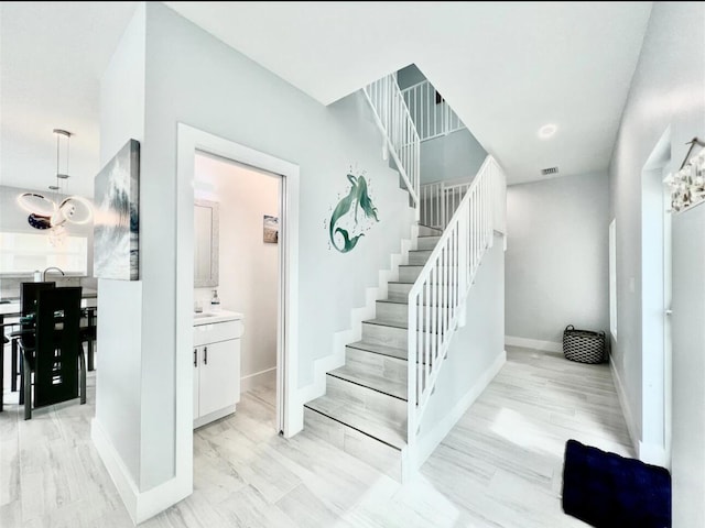 1021 82nd St, Marathon, FL 33050 - stairs featuring wood finished floors, baseboards, and visible vents