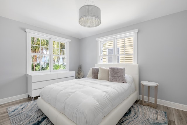 bedroom with hardwood / wood-style flooring