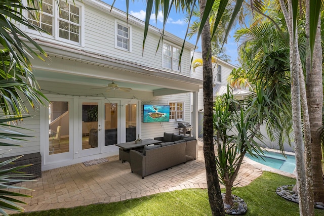 view of patio with french doors, ceiling fan, and grilling area