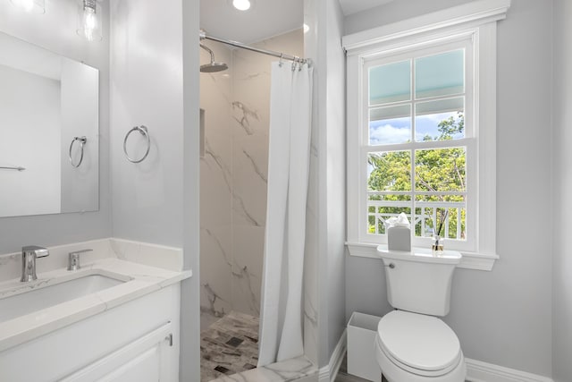 bathroom with vanity, toilet, and a shower with shower curtain