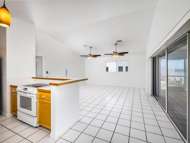 kitchen featuring a healthy amount of sunlight, lofted ceiling, decorative light fixtures, and white range with electric cooktop