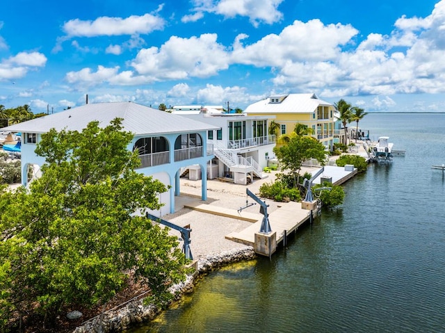 view of dock with a deck with water view