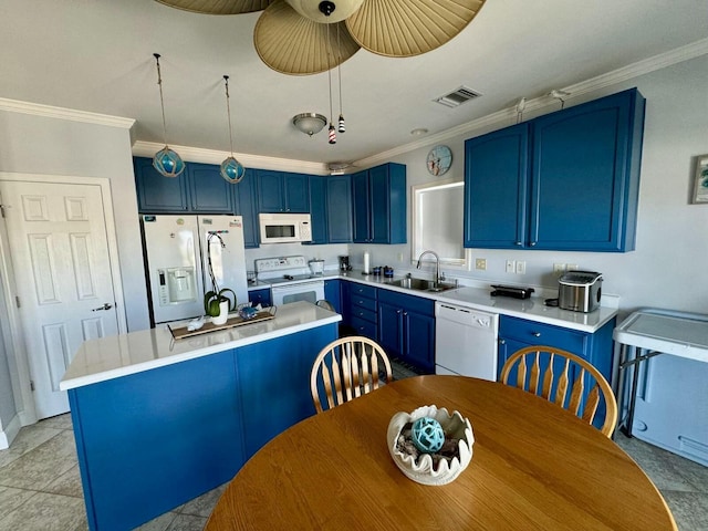 kitchen featuring blue cabinets, white appliances, a sink, visible vents, and crown molding