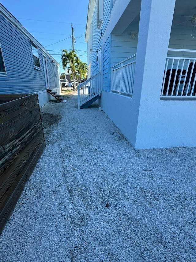 view of side of property featuring stucco siding