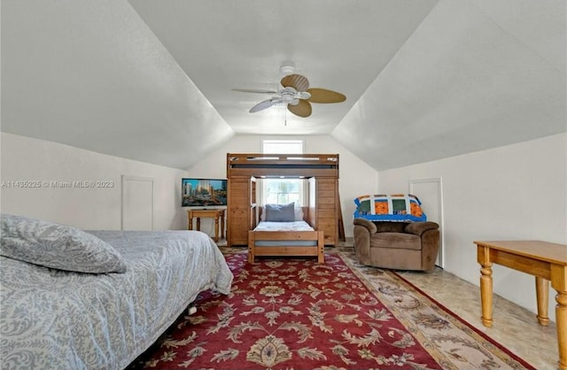 carpeted bedroom featuring lofted ceiling and a ceiling fan