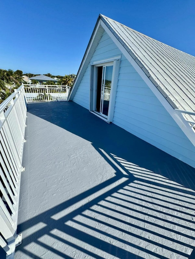 view of home's exterior with a standing seam roof and metal roof