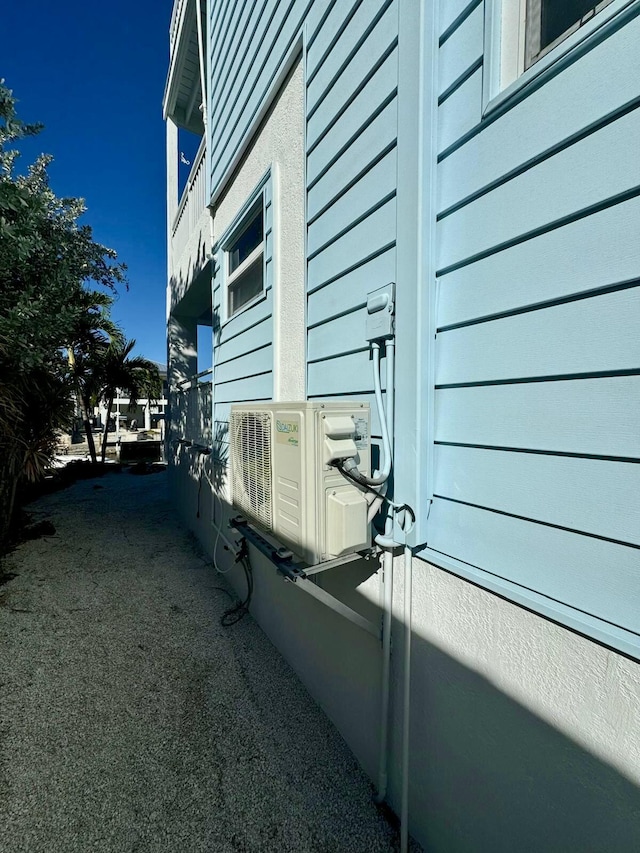 view of home's exterior with ac unit