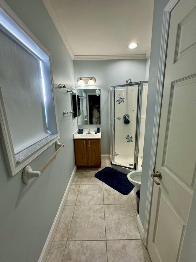 bathroom with a stall shower, baseboards, ornamental molding, tile patterned flooring, and vanity