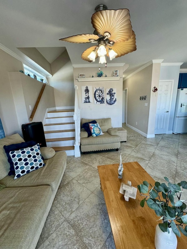 living room featuring stairs, ceiling fan, baseboards, and crown molding
