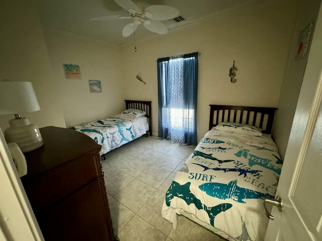 bedroom featuring ceiling fan, visible vents, and light tile patterned flooring