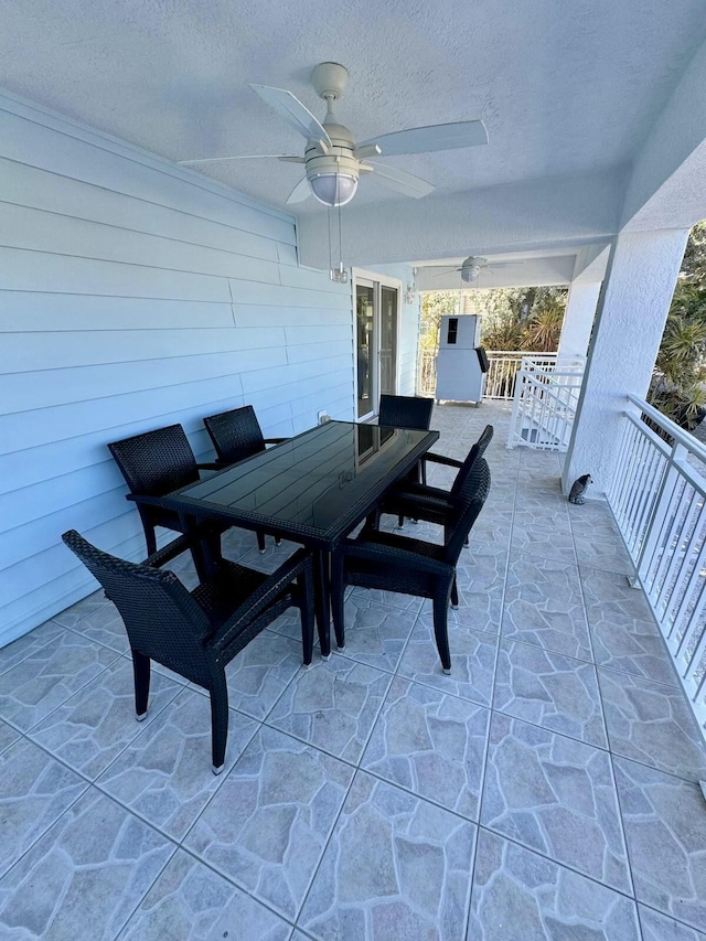view of patio / terrace featuring outdoor dining space and ceiling fan