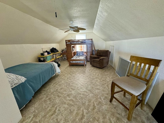 bedroom featuring lofted ceiling, ceiling fan, and a textured ceiling